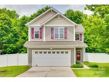 Charming two-story home with a two-car garage, neutral siding, red shutters, and a well-maintained front yard at 288 Sand Paver Way # 50, Fort Mill, SC 29708
