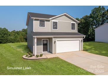 Charming two-story home features a front-entry two car garage, manicured lawn and welcoming front porch at 823 32Nd Ne St, Conover, NC 28613
