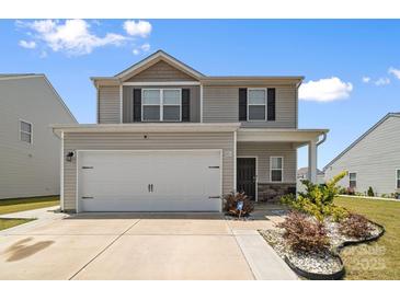 Charming two-story home with a two-car garage and neatly landscaped front yard at 2011 Valdosta Way, Charlotte, NC 28215