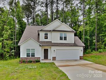 Charming two-story home with a two-car garage and inviting curb appeal at 2612 Cold Springs Rd, Concord, NC 28025
