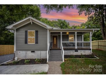 Charming bungalow-style home featuring a cozy front porch and freshly landscaped front yard at 952 Salisbury St, Wadesboro, NC 28170