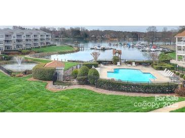 A luxurious condo community featuring a pool, fountain, and marina on the beautiful waterfront at 1038 Southwest Dr, Davidson, NC 28036