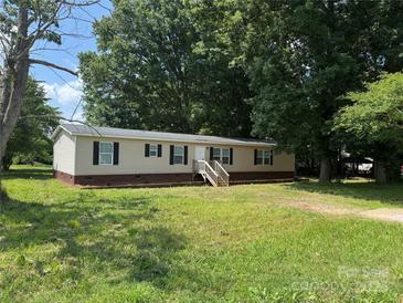 Inviting single story home with green lawn and classic black shutters at 1555 Moore Rd, York, SC 29745