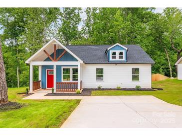 Charming single-Gathering home with a welcoming front porch and bright red door at 516 North Mulberry St, Cherryville, NC 28021