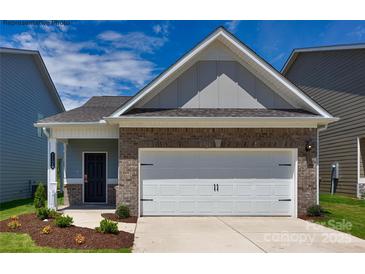 Charming single-Gathering home showcasing a brick facade and a convenient two-car garage, offering a blend of style and functionality at 1255 Langston Ln, Salisbury, NC 28144
