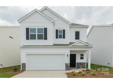 Charming two-story home with a two-car garage and well-manicured landscaping at 1272 Langston Ln, Salisbury, NC 28144
