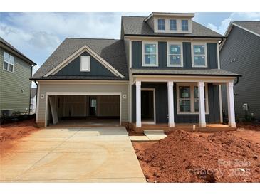 New two-story home with a spacious two-car garage and classic architectural details at 626 Amberjack Pl # 79, York, SC 29745