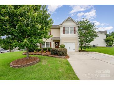 Charming two-story home with manicured lawn and inviting curb appeal at 611 Sawtooth Oak Dr, Landis, NC 28088