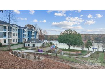 Modern apartment complex with lake views and outdoor seating area near lake at 4455 Reed Creek Dr # 202, Sherrills Ford, NC 28673