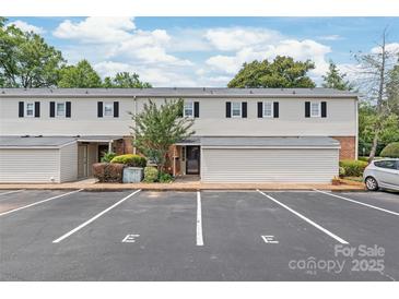 Inviting two-story townhouse with dedicated parking spots and landscaped grounds at 5949 Quail Hollow Rd # E, Charlotte, NC 28210