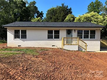 Charming, renovated single-story home featuring a classic brick facade and inviting front entrance at 756 Logan St, Mooresville, NC 28115