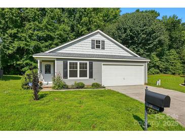 Charming one-story home featuring a well-manicured lawn and an attached garage, perfect for suburban living at 611 Annalinde Ln, Rock Hill, SC 29732