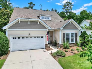 Charming one-story home featuring a manicured lawn, attached garage, and welcoming facade, perfect for suburban living at 964 Knob Creek Ln, Fort Mill, SC 29708