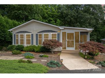 Charming single story home with well-maintained landscaping and inviting screened-in porch at 111 Trails End Ln, New London, NC 28127