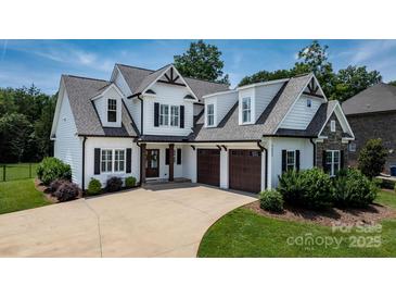Charming two-story home with a landscaped yard, attached garage, and inviting curb appeal at 3622 46Th Ne Ave, Hickory, NC 28601