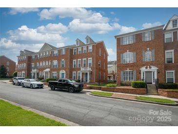 Charming brick townhome with manicured landscaping and a welcoming entrance at 11123 Waxberry Dr, Charlotte, NC 29277