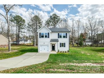 Two-story home with a white facade, black shutters, a single car garage, and a concrete driveway at 2583 Watson Dr, Lancaster, SC 29720