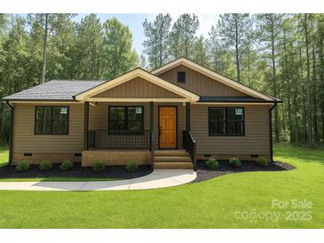 Charming single-story home with a welcoming porch and manicured lawn at 2330 Neill Rd, Lancaster, SC 29720