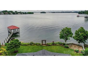 Expansive lake view with gazebo and lush landscaping from this waterfront property at 7945 Placid Ct, Denver, NC 28037