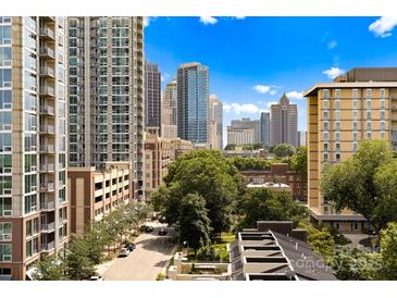 A view of a skyline of Charlotte from atop a building on a clear day with blue sky at 715 N Church St # 513, Charlotte, NC 28202