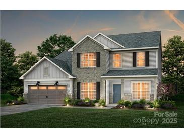 Charming two-story home showcases stone accents, a two-car garage, and manicured landscaping, offering a welcoming curb appeal at 13932 Penbury Rd # 400, Charlotte, NC 28278