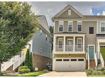 Charming townhome features a front porch, attached garage, and well-maintained landscaping at 402 Belton St, Charlotte, NC 28209