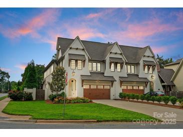 Stunning two-story home with a three-car garage, lush lawn, and meticulously maintained landscaping at 6242 Creola Rd, Charlotte, NC 28270