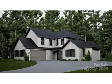 Beautiful exterior elevation featuring a modern design with stone accents, black trim, and an attached garage at 10220 Idlewild Rd, Matthews, NC 28105