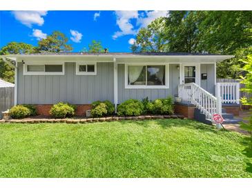 Charming single-story home with a well-manicured lawn and inviting front entrance at 411 Belvedere Cir, Kings Mountain, NC 28086