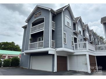 Charming three-story condo featuring double balconies and convenient garage access at 508 N Graham St # N, Charlotte, NC 28202