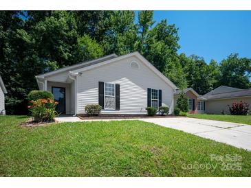 Charming single-story home with well-maintained lawn and mature trees in a desirable neighborhood at 5717 Fairchase Ave, Charlotte, NC 28269