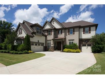 Attractive two-story home with a well-manicured lawn and a spacious driveway at 426 Kirkbride Ct, Fort Mill, SC 29715