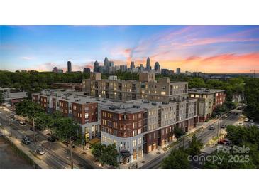 Stunning exterior view of a modern building with city skyline, lush greenery, and a captivating sunset backdrop at 1315 East Blvd # 203, Charlotte, NC 28203