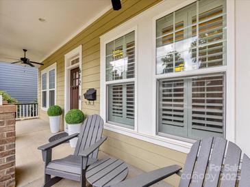 Inviting front porch with comfortable seating and stylish decor offers a welcoming entrance to the home at 612 Ideal Way, Charlotte, NC 28203