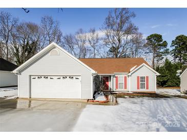 Charming single-story home with attached garage and red shutters, perfect for any Gathering at 676 Rebecca Jane Dr, Mooresville, NC 28115