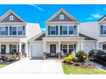 Charming two-story home with a welcoming front porch and a beautifully landscaped front yard at 103 Blackstone Ct # C, Statesville, NC 28677
