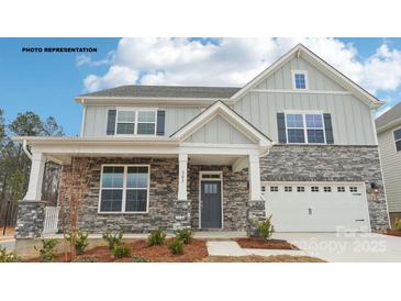 Charming two-story home featuring stone accents and a welcoming front porch at 248 Miramar Dr, York, SC 29745