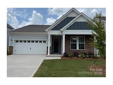 Charming single-story home with a two-car garage and well-manicured lawn at 156 Ella Claire Dr, York, SC 29745