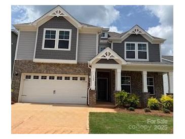 Charming two-story home with a brick and gray siding exterior and a two-car garage at 160 Ella Claire Dr, York, SC 29745