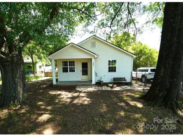 Charming bungalow-style home with a covered front porch and well-maintained yard with mature shade trees at 201 W 19Th St, Kannapolis, NC 28081
