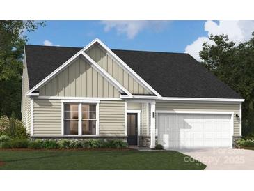 Charming one-story home with stone accents, well-manicured lawn, and attached garage at 2026 Mantle Ridge Dr, Indian Trail, NC 28079