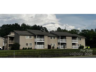 A multi-Gathering condo with private balcony and mature trees creating a park-like setting at 140 Lake Concord Ne Rd, Concord, NC 28025