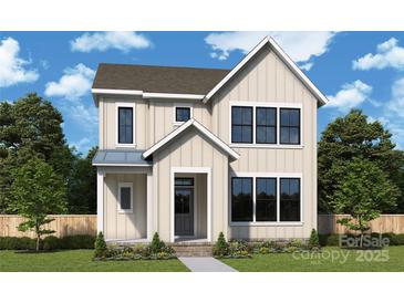 Charming two-story home with a classic farmhouse design, large windows, and a welcoming front porch at 7213 Westrow Ave, Charlotte, NC 28278