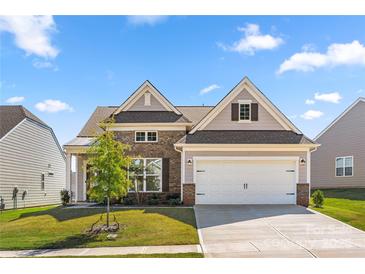 Charming two-story home with a two car garage, brick and siding exterior, landscaped yard, and inviting curb appeal at 125 White Apple Way, Statesville, NC 28625