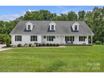Charming single-story home with a welcoming front porch and well-manicured lawn at 247 Helton Rd, Cherryville, NC 28021