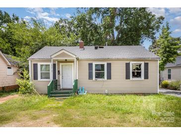 Quaint single-story home with neutral siding, dark shutters, and a welcoming front porch at 638 E Black St, Rock Hill, SC 29730