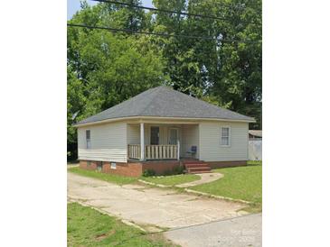 Charming one-story home with a covered porch and a well-maintained front yard at 411 Klumac Rd, Salisbury, NC 28144