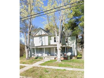 Charming two-story home with a inviting front porch perfect for enjoying the outdoors at 500 7Th St, Spencer, NC 28159