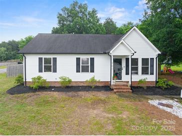 Charming single-story home with a well-manicured lawn and fresh landscaping, offering great curb appeal at 301 Rowan Gq St, Salisbury, NC 28146