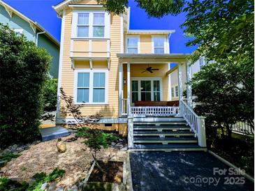 Charming yellow two-story home with a welcoming front porch and manicured landscaping at 751 Terrace Park, Rock Hill, SC 29730